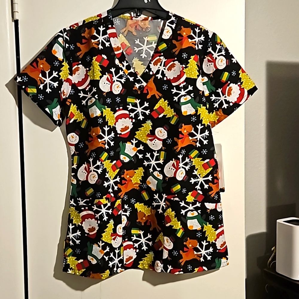 Christmas scrub top with Reindeer, Santa, snowmen, penguins, and presents